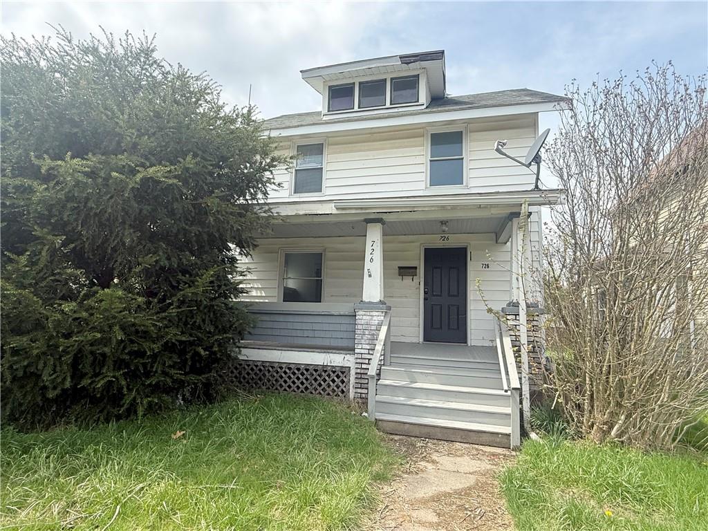 726 Baldwin Avenue Sharon, PA 16146 - Photo 1 of 11 a front view of a house with a garden