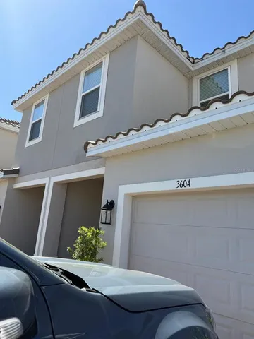 a view of a house with a cars park