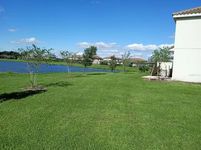 a view of a golf course with a big yard