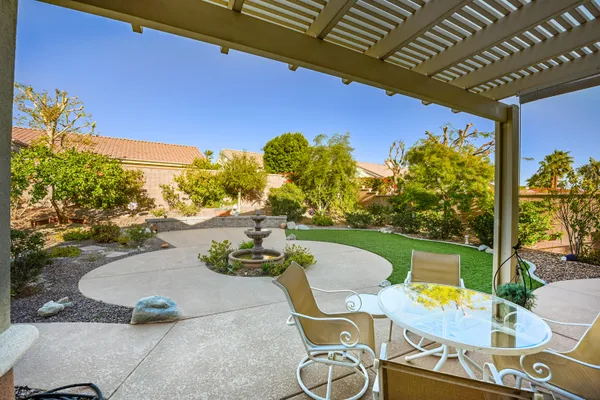 a view of a swimming pool with a patio