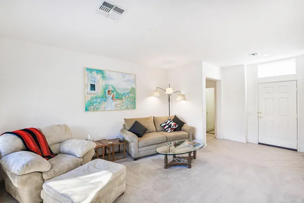 a living room with furniture and a couch