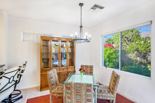 a view of a dining room with furniture window and outside view