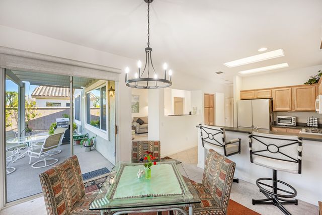 a view of a livingroom with furniture and a chandelier