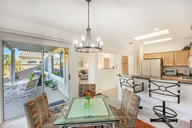 a view of a livingroom with furniture and a chandelier