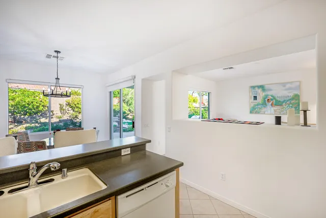 a kitchen with a sink and a window