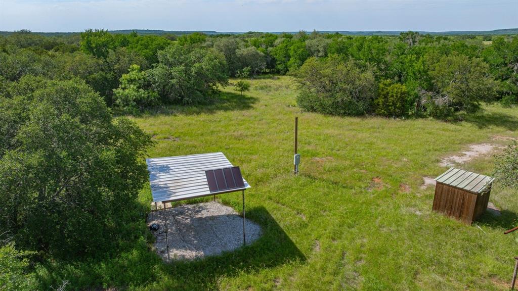 136 Moose Trail Ranger, TX 76470 - Photo 14 of 40 a view of a back yard from a lake view