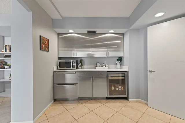 a bedroom with a bed and a view of living room