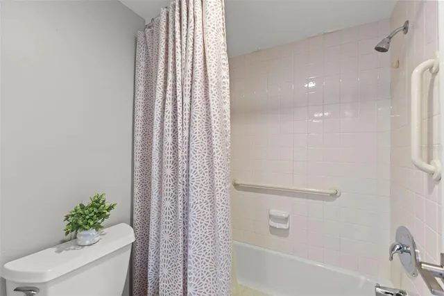 a bedroom with two beds and a large window