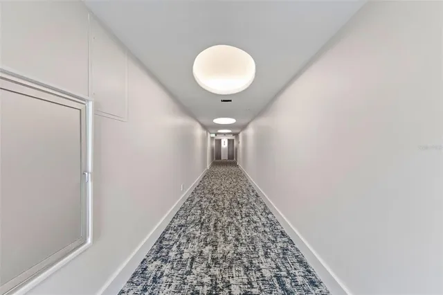 a balcony with furniture and a potted plant