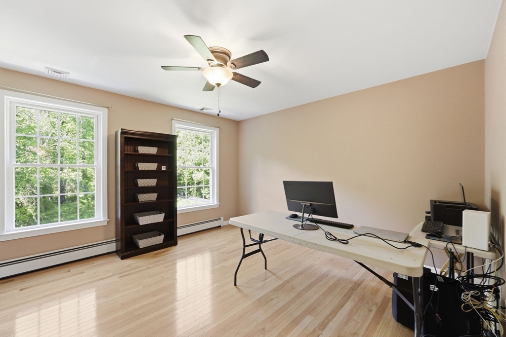 345 Bragg Road Warren, MA 01585 - Photo 30 of 41 a view of a workspace with furniture and a window