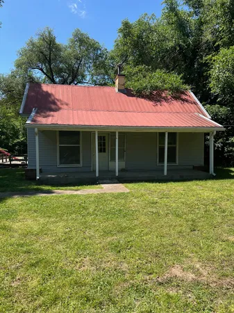 a view of a house with a garden