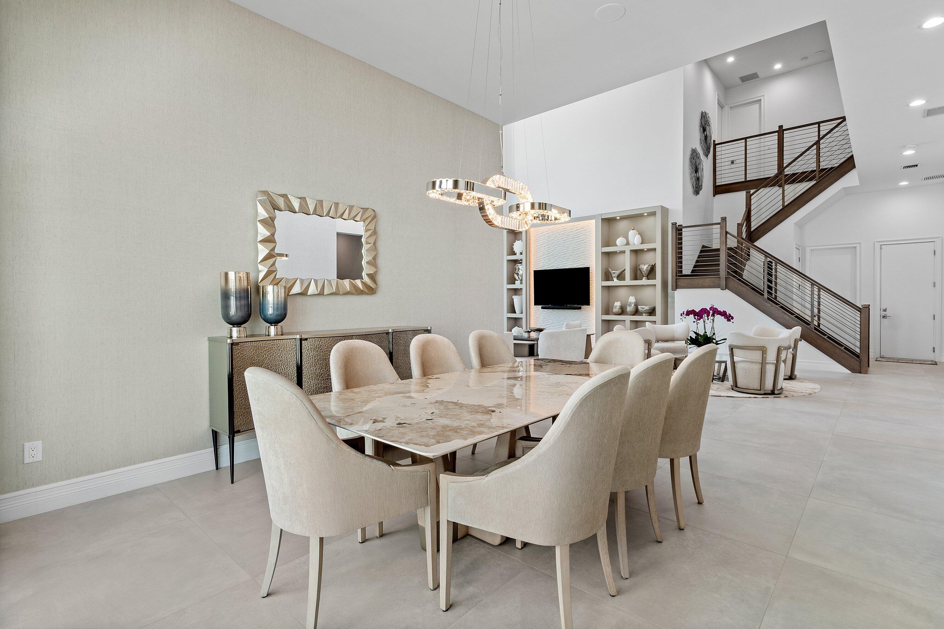 17432 Ponte Chiasso Drive Boca Raton, FL 33496 - Photo 11 of 116 a dining room with furniture and wooden floor