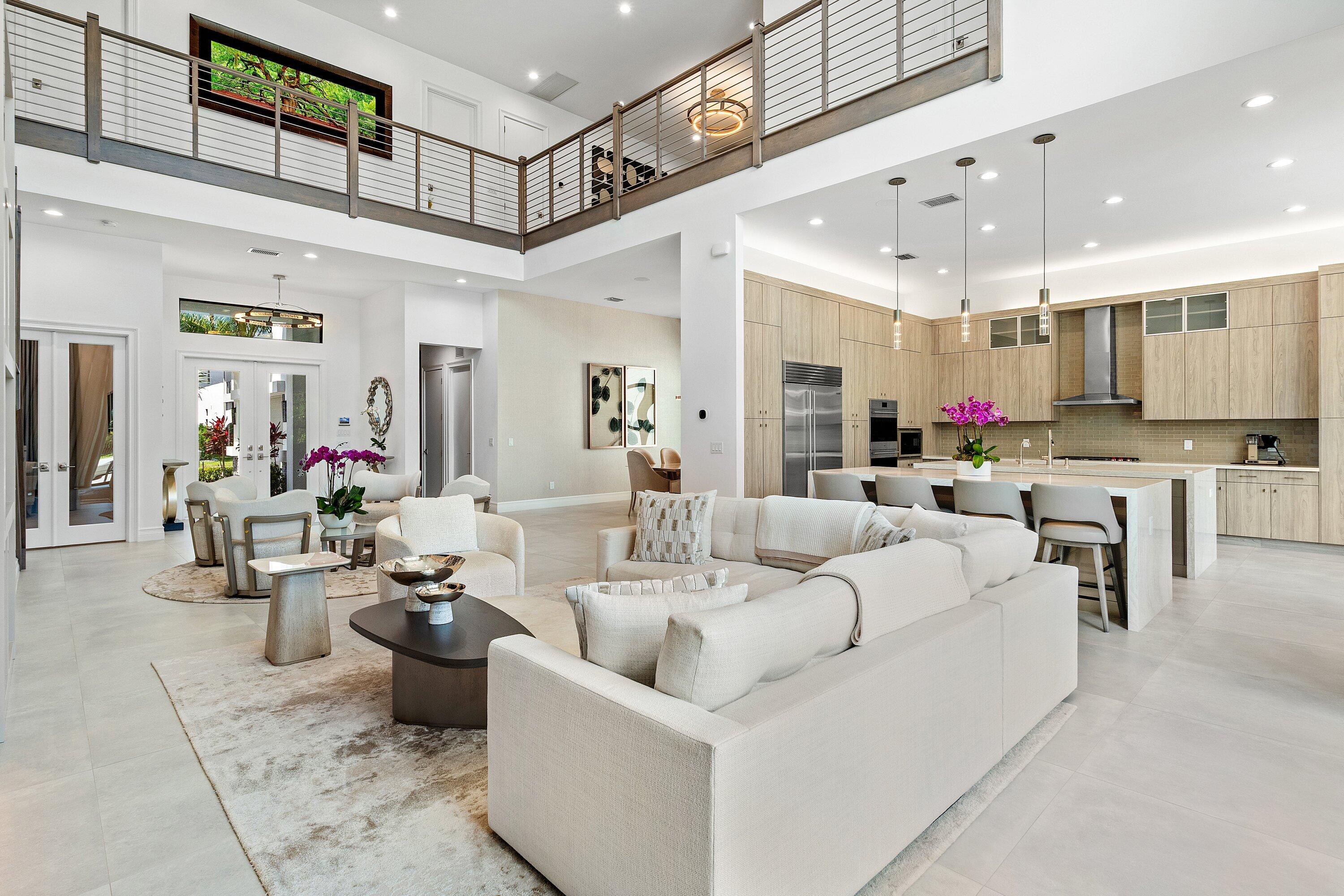 17432 Ponte Chiasso Drive Boca Raton, FL 33496 - Photo 15 of 116 a living room with furniture kitchen view and a chandelier