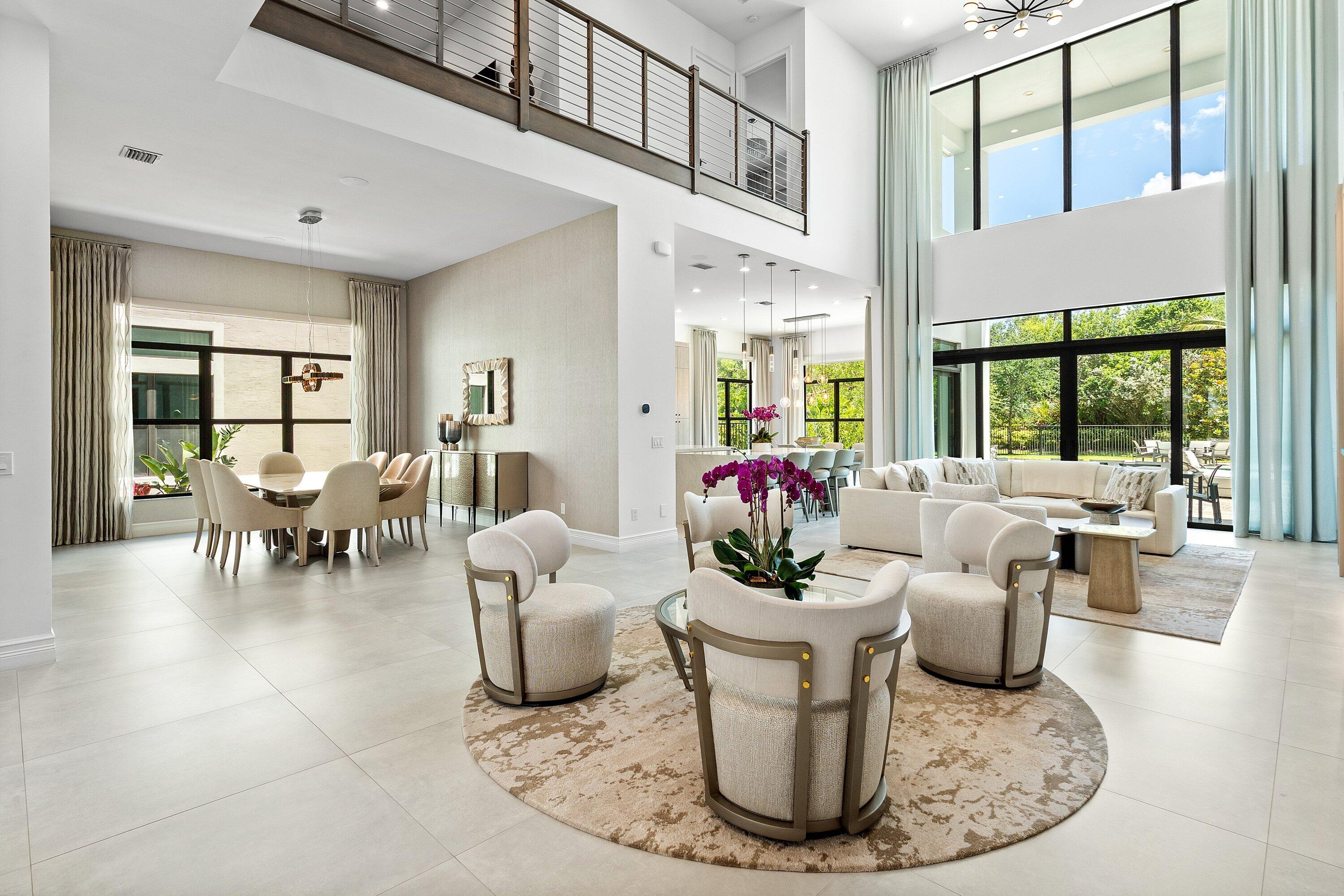 17432 Ponte Chiasso Drive Boca Raton, FL 33496 - Photo 16 of 116 a dining room with furniture a large window and a rug