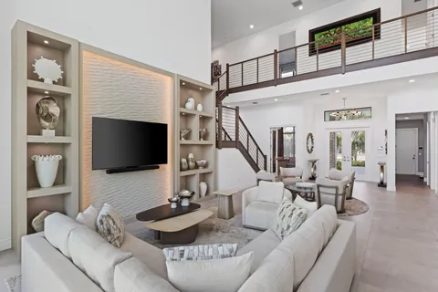 a bedroom with a bed and a ceiling fan