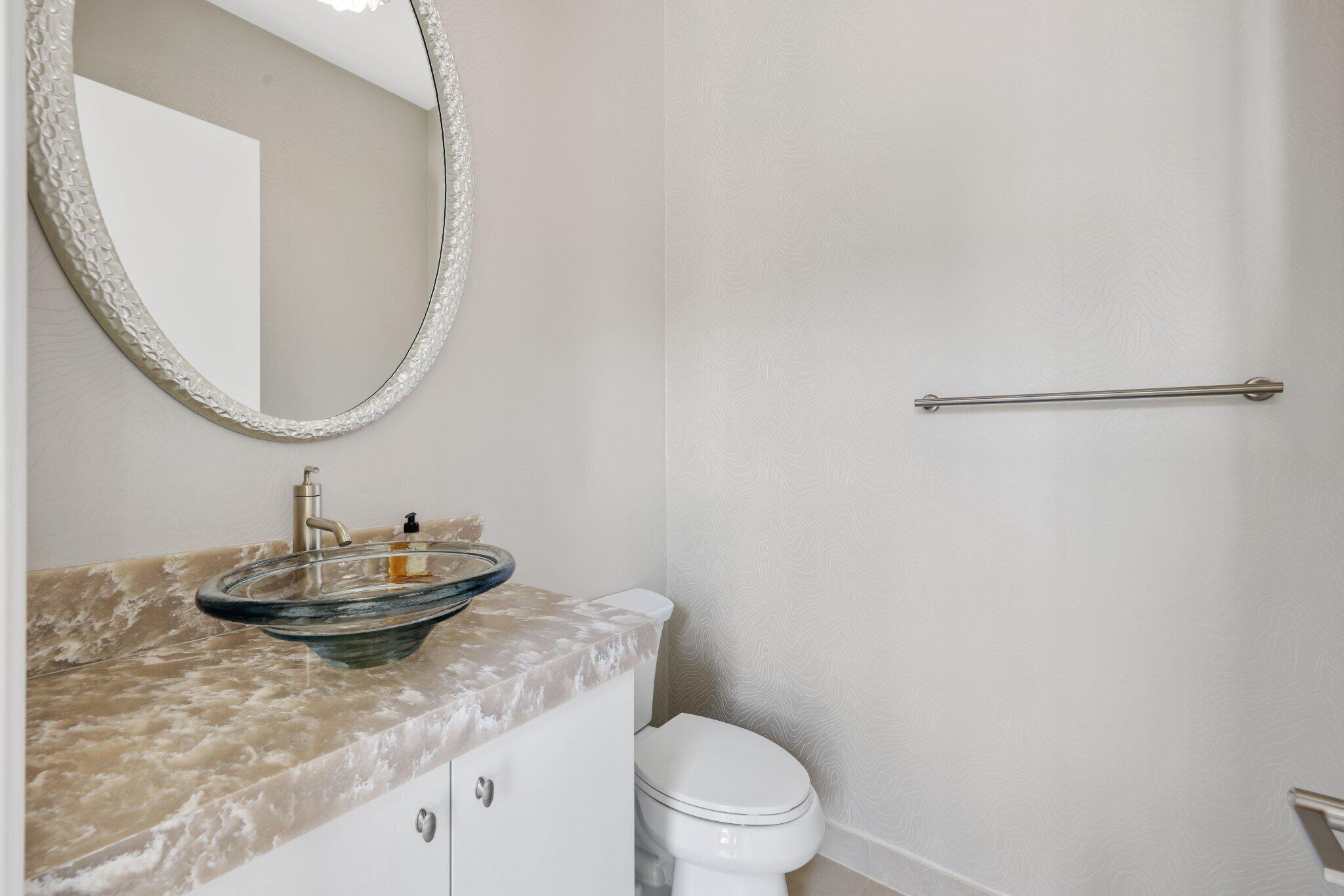 17432 Ponte Chiasso Drive Boca Raton, FL 33496 - Photo 37 of 117 a bathroom with a granite countertop sink a toilet and a mirror
