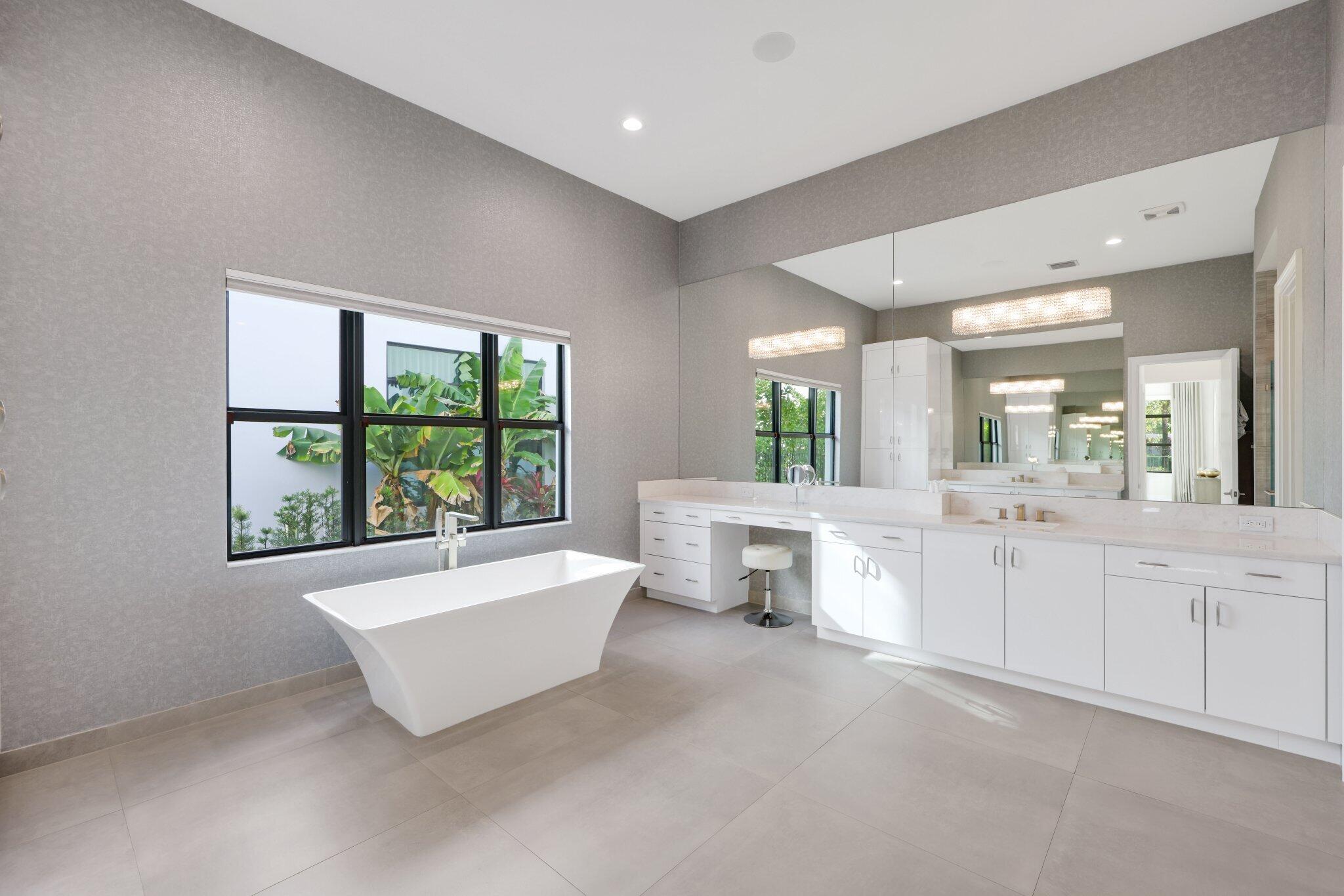 17432 Ponte Chiasso Drive Boca Raton, FL 33496 - Photo 40 of 116 a spacious bedroom with a large bed and a window