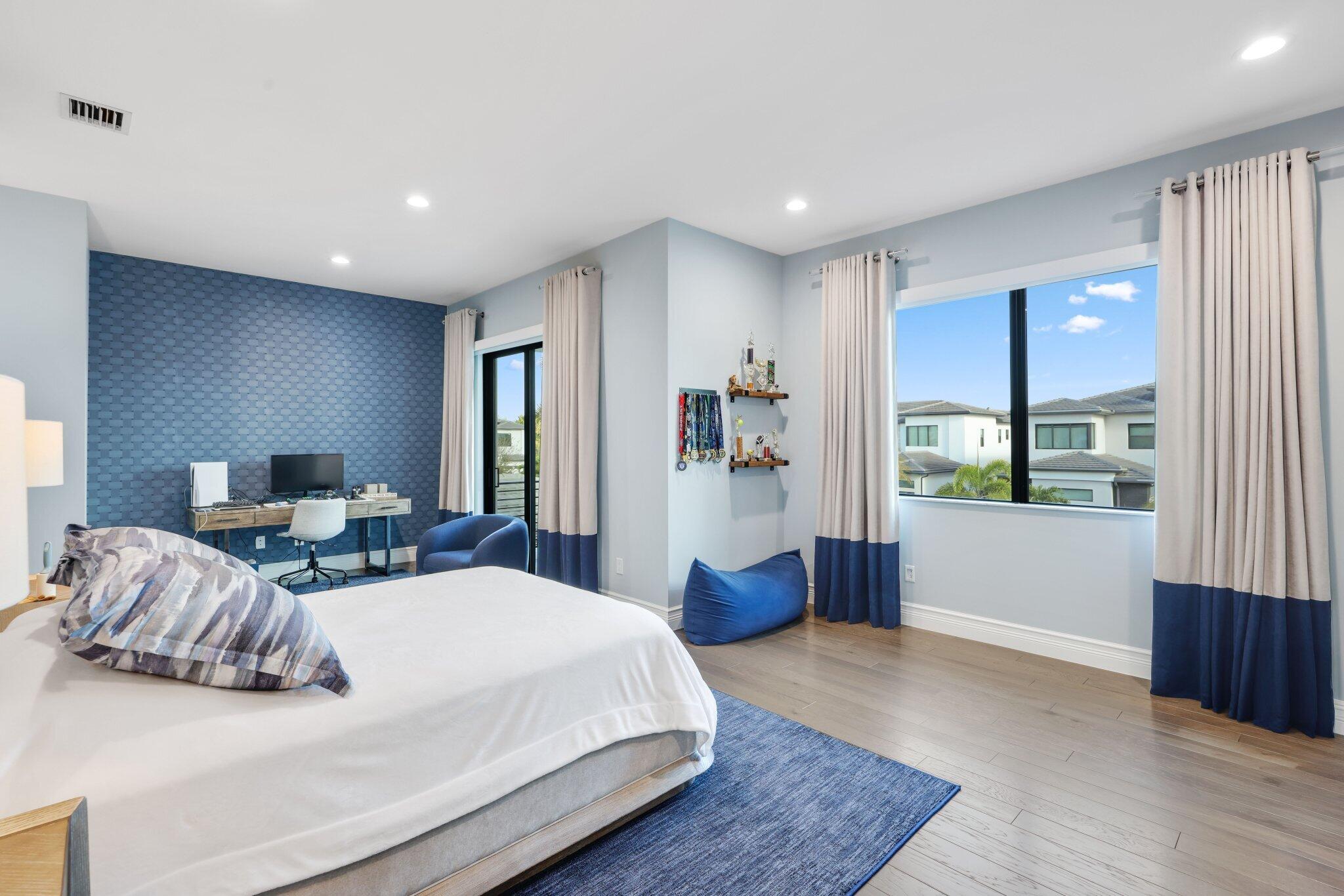 17432 Ponte Chiasso Drive Boca Raton, FL 33496 - Photo 57 of 117 a large bedroom with bed and window