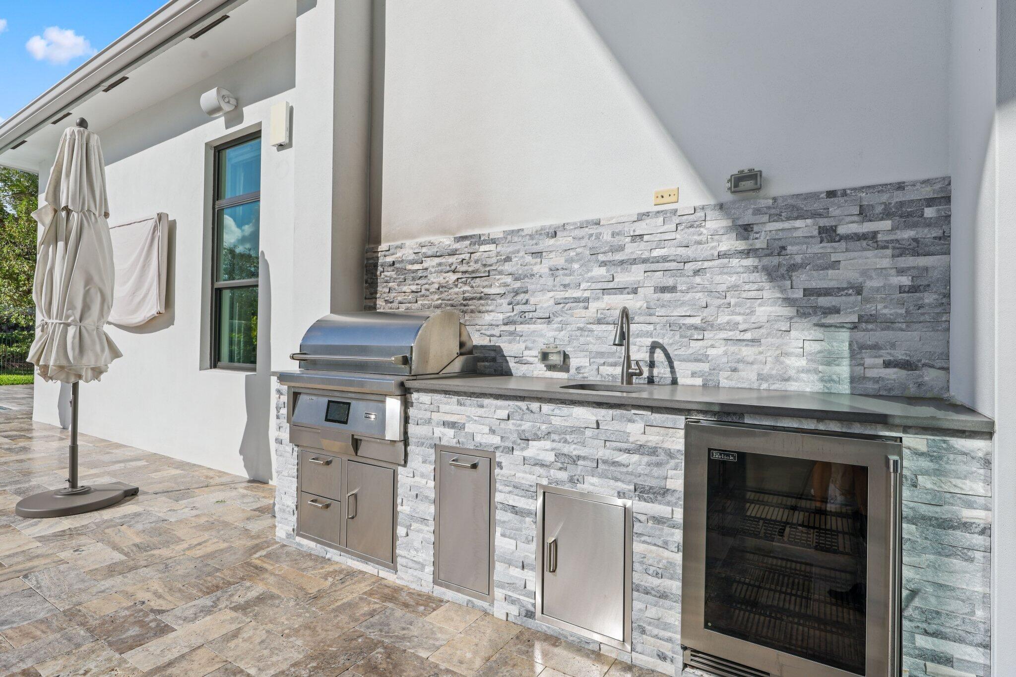 17432 Ponte Chiasso Drive Boca Raton, FL 33496 - Photo 76 of 117 a kitchen with stainless steel appliances granite countertop a stove and a refrigerator