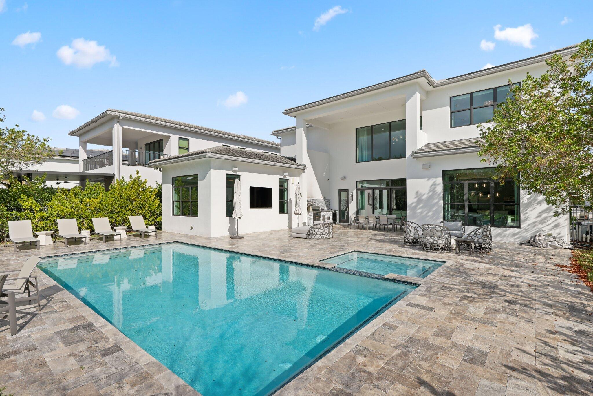 17432 Ponte Chiasso Drive Boca Raton, FL 33496 - Photo 93 of 116 a swimming pool with outdoor seating and yard