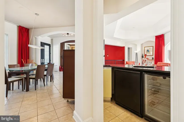 a living room with fireplace furniture and a large window
