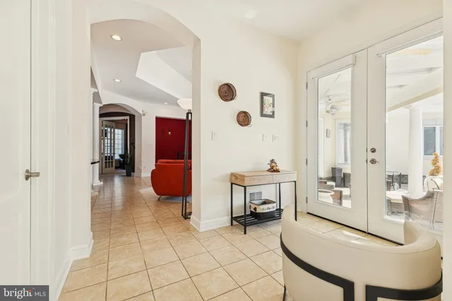 a bedroom with furniture and a large mirror