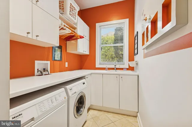 a spacious bedroom with a bed and dresser