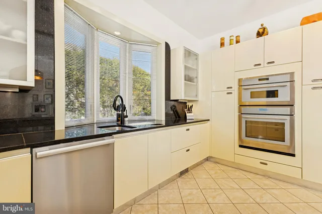 a living room with furniture pool table and a flat screen tv
