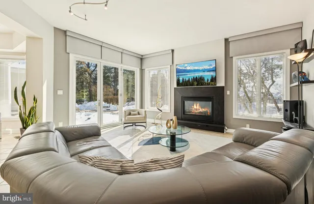 a view of kitchen with stainless steel appliances granite countertop a refrigerator and a stove