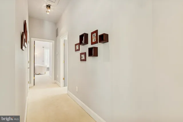 a view of a kitchen with appliances and sitting area
