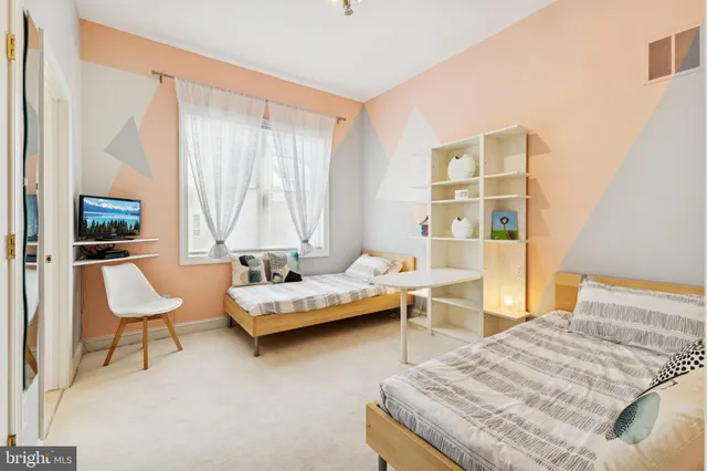 a view of a dinning table and chairs in patio of a house