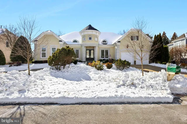 a view of a swimming pool with outdoor seating