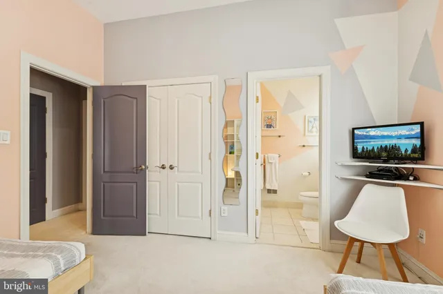 a living room with fireplace furniture and a large window