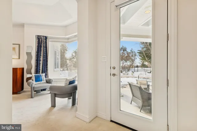 an aerial view of a house with a yard and lake view