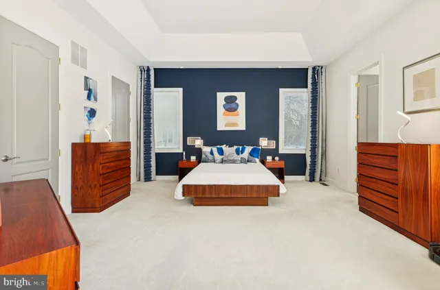 a view of a patio with table and chairs with wooden fence