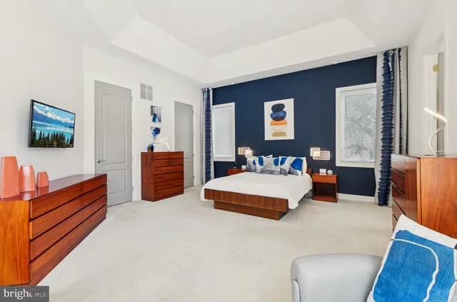 a view of a house with swimming pool and sitting area