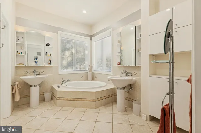 an aerial view of a house with a swimming pool yard and outdoor seating