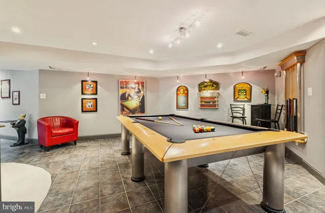 a swimming pool with lots of tress in front of it