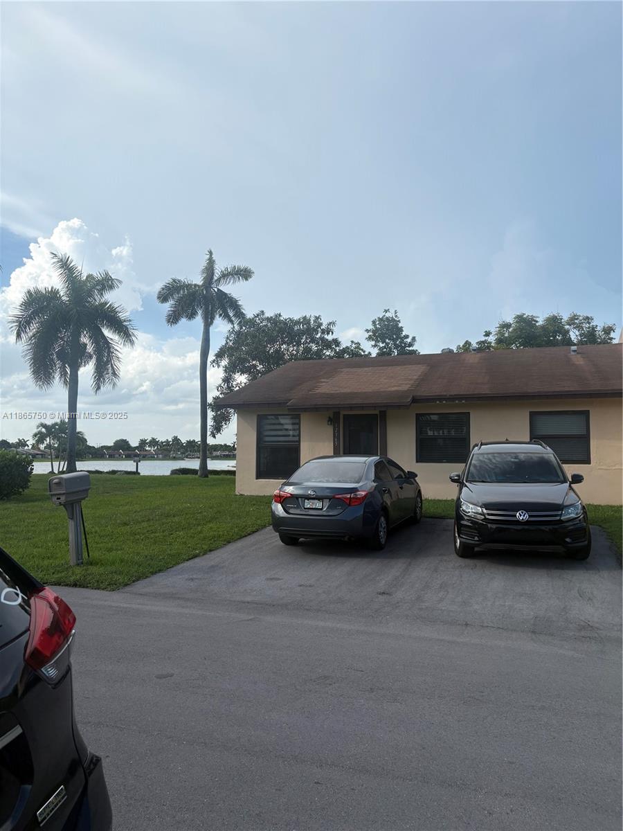 a view of a car parked in front of a house