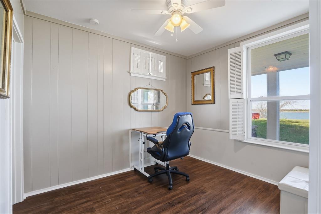 13280 Beach Club Road The Colony, TX 75056 - Photo 23 of 40 a view of a workspace with wooden floor and windows
