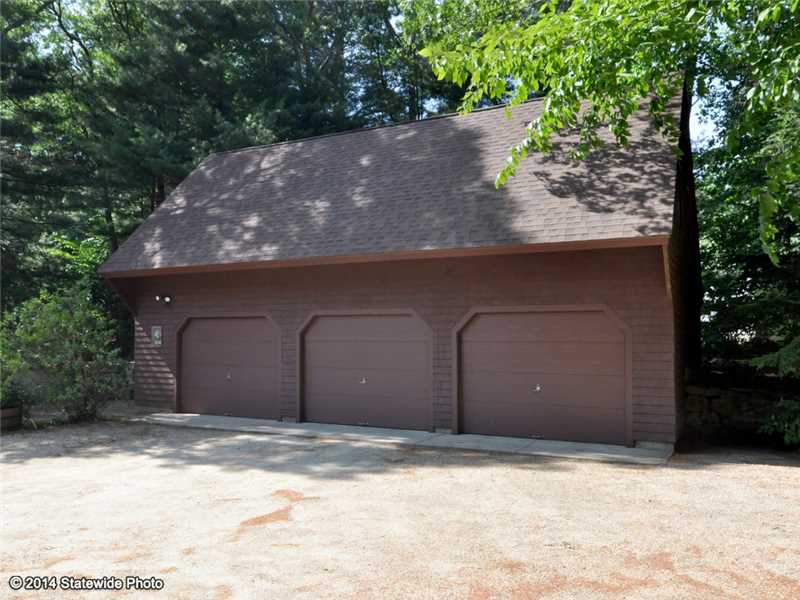 395 Widow Sweets Road Exeter, RI 02822 - Photo 13 of 23 Parking Lot/Garage. 3 car heated garage with workshop above!