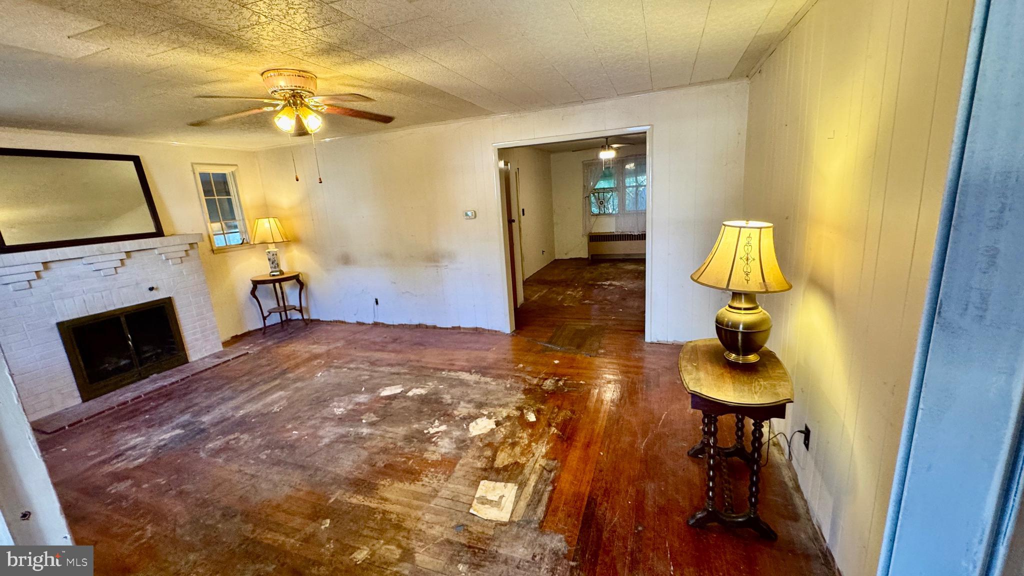 1 Potomac Street Crisfield, MD 21817 - Photo 4 of 15 a living room with furniture and a fireplace