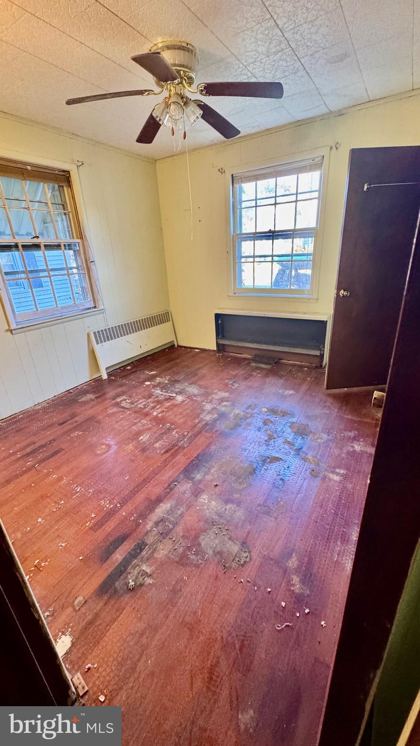 1 Potomac Street Crisfield, MD 21817 - Photo 8 of 15 a view of an empty room with a window