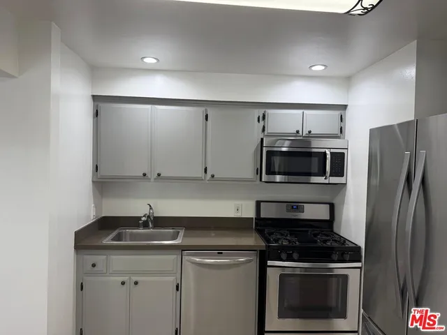 a kitchen with a stove and a microwave
