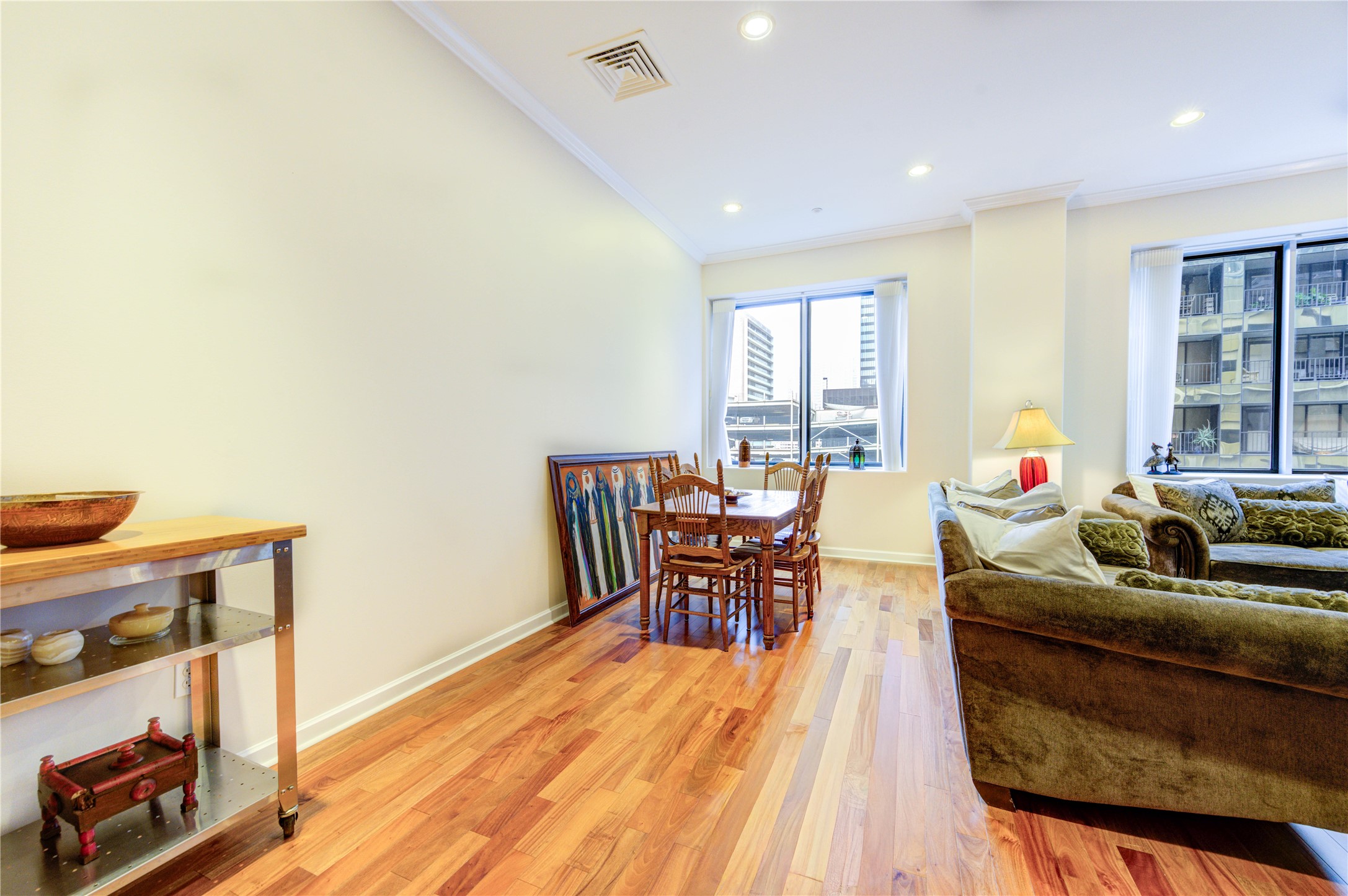 914 Main Street, Unit 911 Houston, TX 77002 - Photo 8 of 30 a living room with furniture and a wooden floor