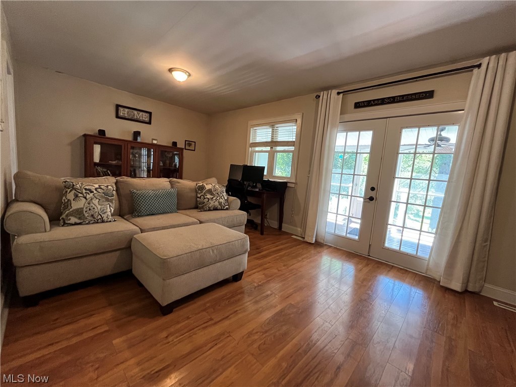 1902 Mathoit Street Parkersburg, WV 26101 - Photo 22 of 35 Living room featuring french doors, plenty of natural light, and light hardwood floors