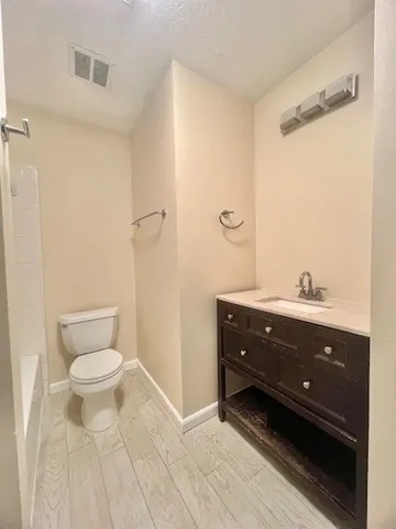 a bathroom with a sink and a toilet