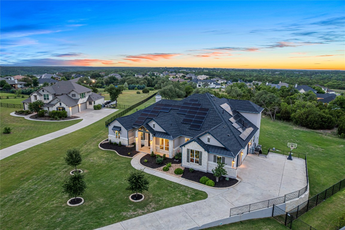 an aerial view of a house with swimming pool garden and outdoor seating