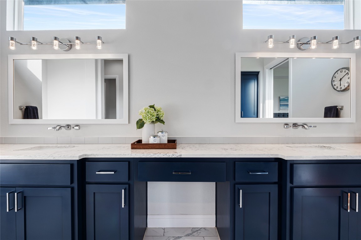 504 Loyal June Trail Leander, TX 78641 - Photo 13 of 16 a bathroom with a sink and a mirror