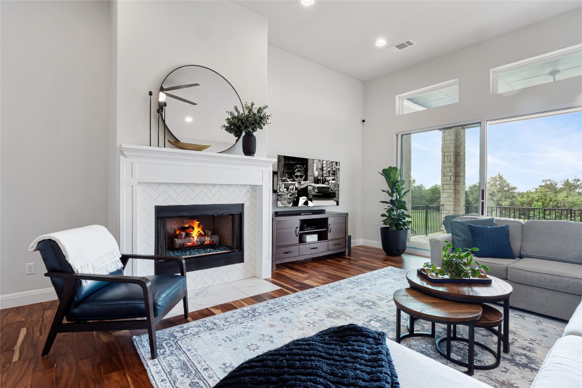 504 Loyal June Trail Leander, TX 78641 - Photo 7 of 16 a living room with furniture and a fireplace